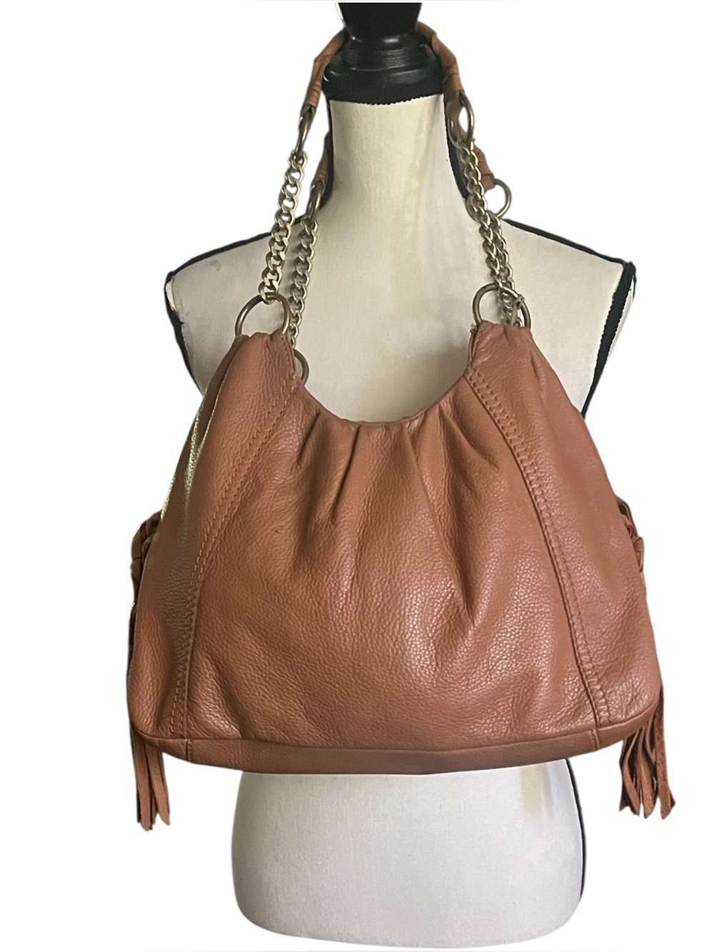 The Sac Pebbled Leather slouchy Hobo Tassel sides  shoulder handbag.